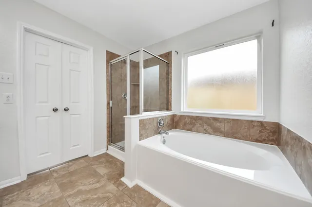 a white bath tub sitting in a bathroom