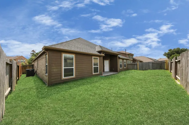 a backyard of a house with lots of green space