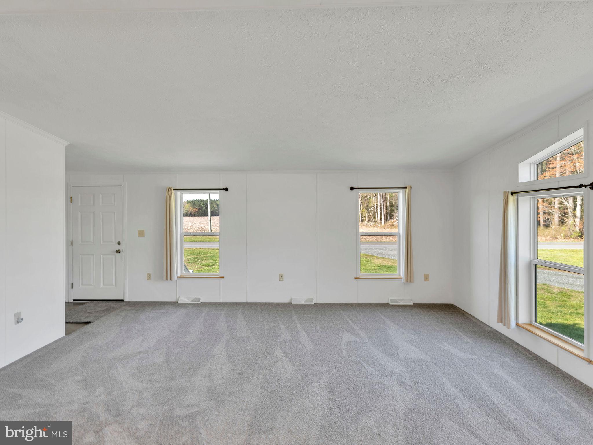 9811 Peerless Road Bishopville, MD 21813 - Photo 11 of 66 an empty room with windows