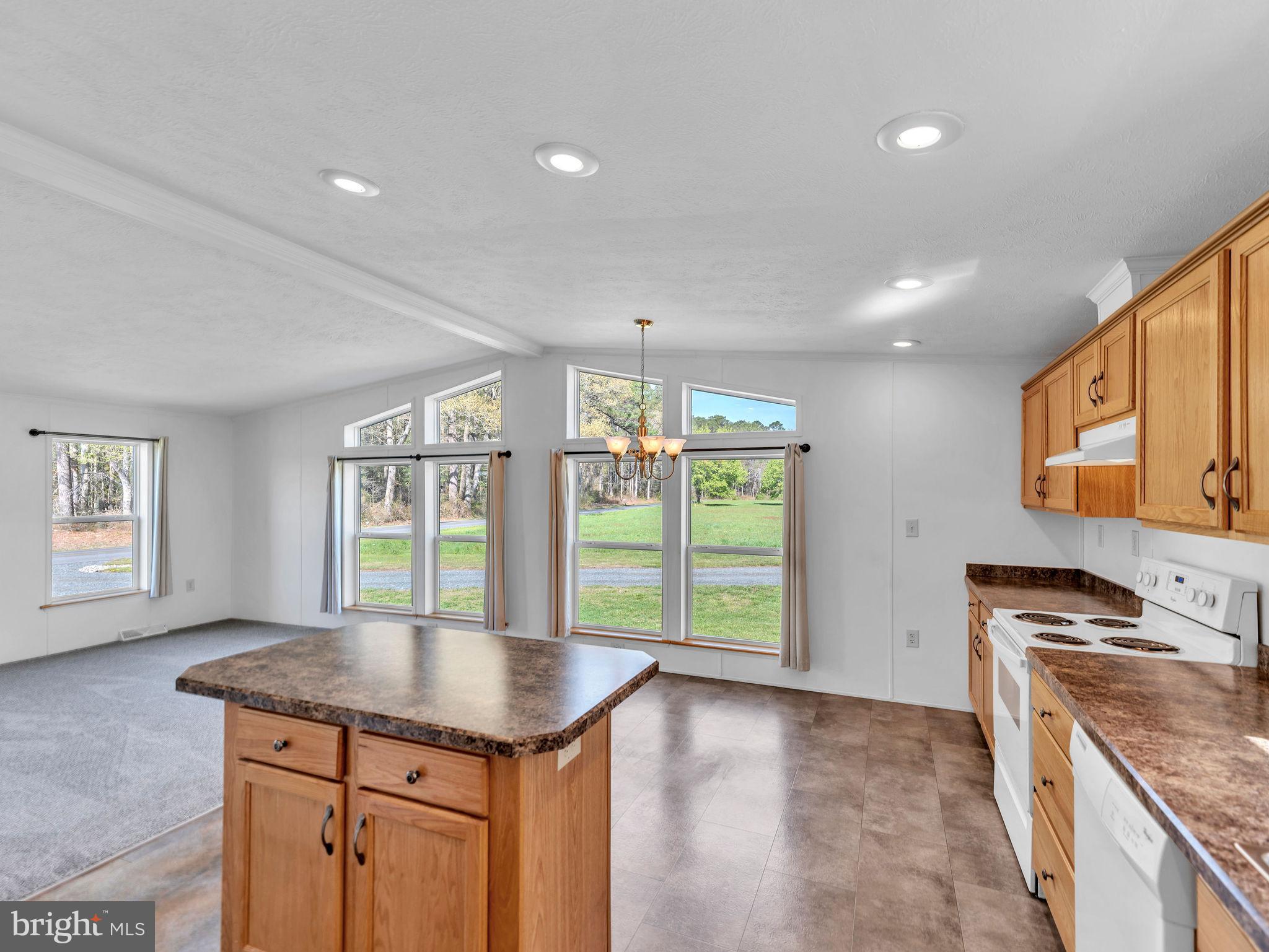 9811 Peerless Road Bishopville, MD 21813 - Photo 2 of 66 a kitchen with stainless steel appliances granite countertop a stove a sink and a refrigerator