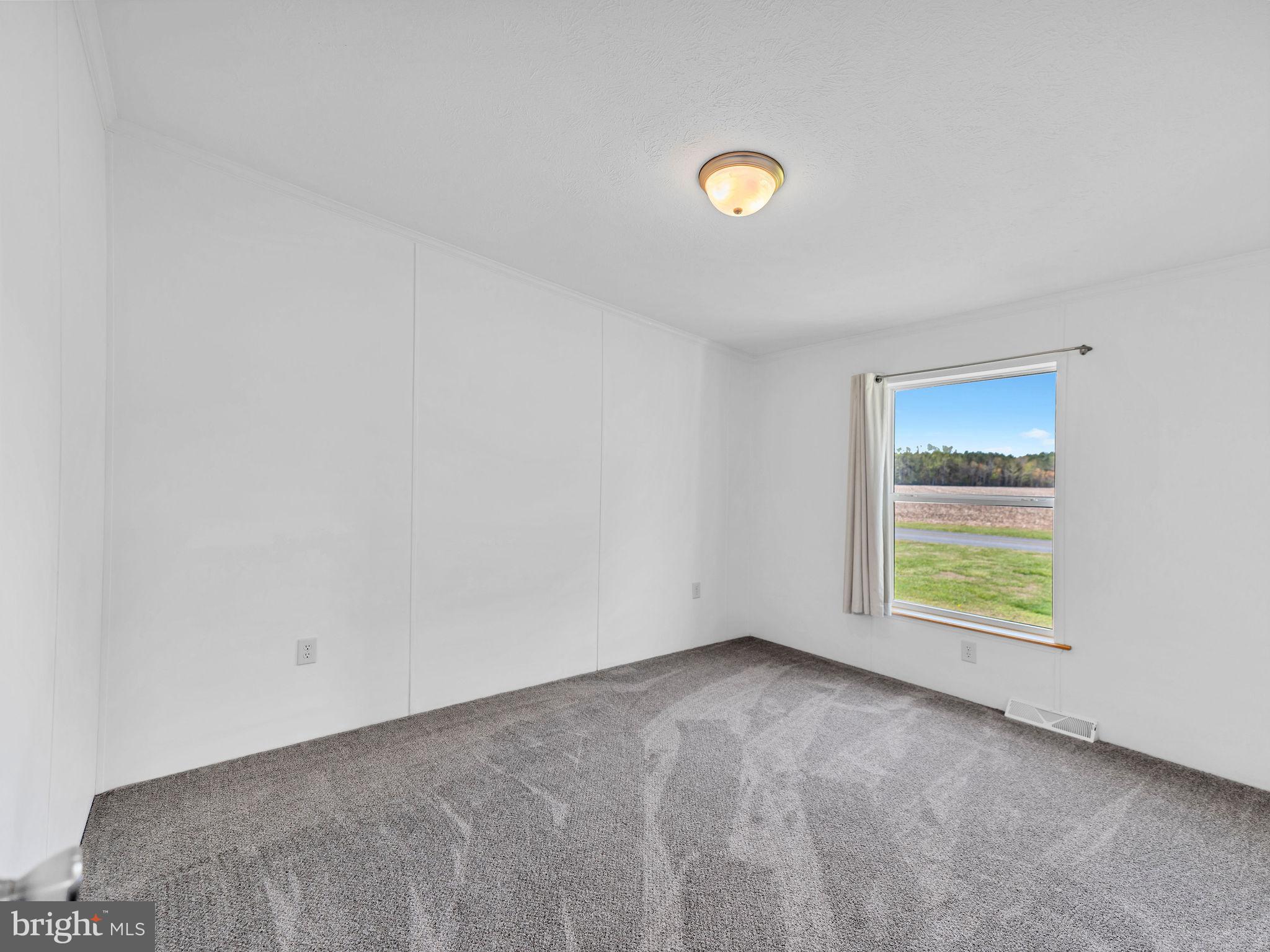 9811 Peerless Road Bishopville, MD 21813 - Photo 21 of 66 a view of a room with a window