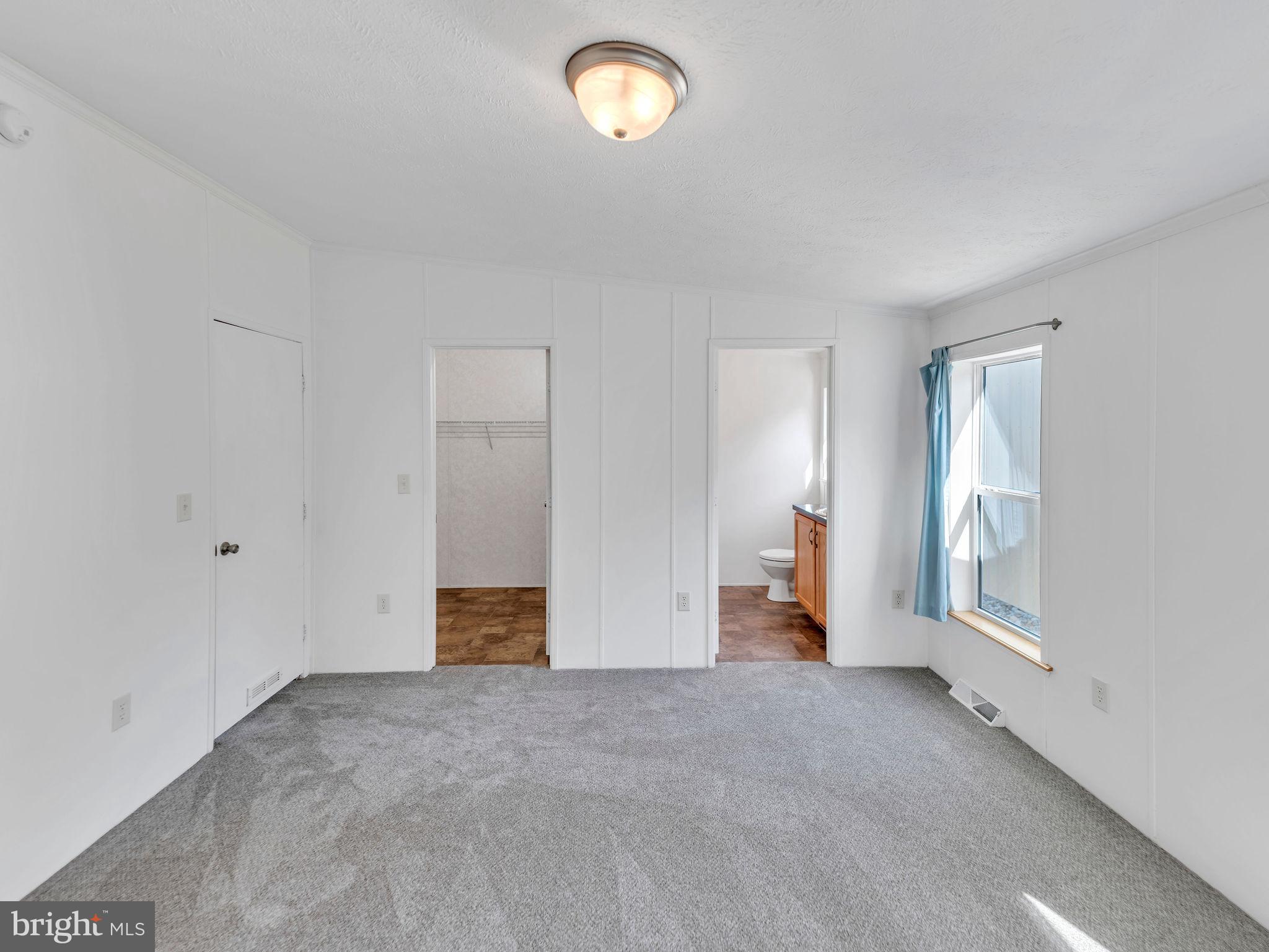 9811 Peerless Road Bishopville, MD 21813 - Photo 25 of 66 a view of empty room with a window
