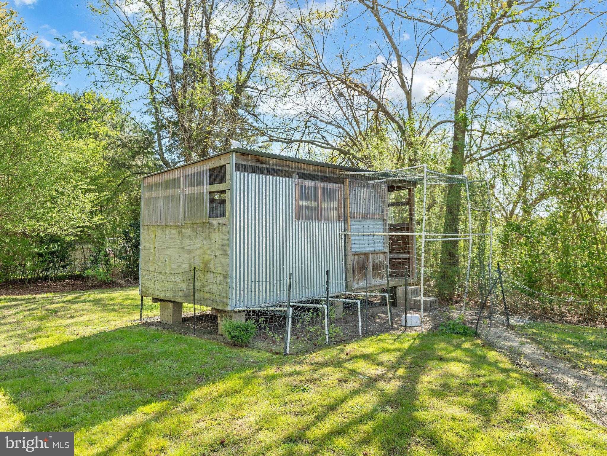 9811 Peerless Road Bishopville, MD 21813 - Photo 38 of 66 a backyard of a house with table and chairs
