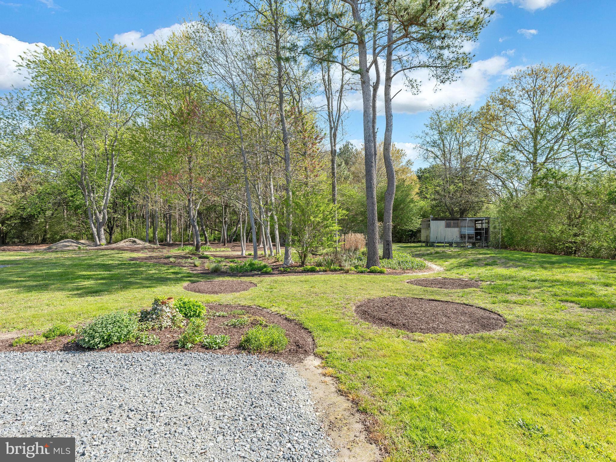 9811 Peerless Road Bishopville, MD 21813 - Photo 4 of 66 a view of a fountain in front of a house