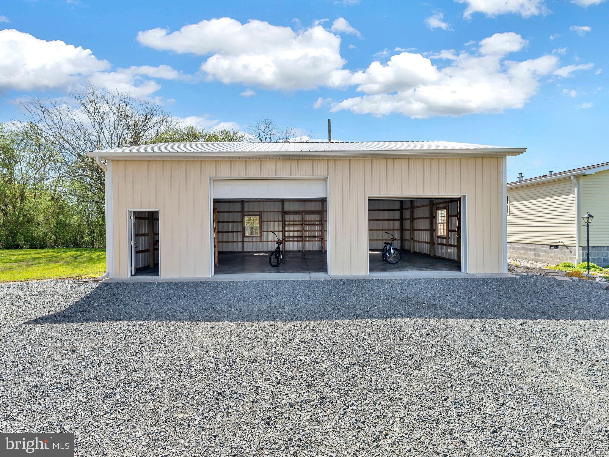 9811 Peerless Road Bishopville, MD 21813 - Photo 42 of 66 a view of a house with a yard and a large tree