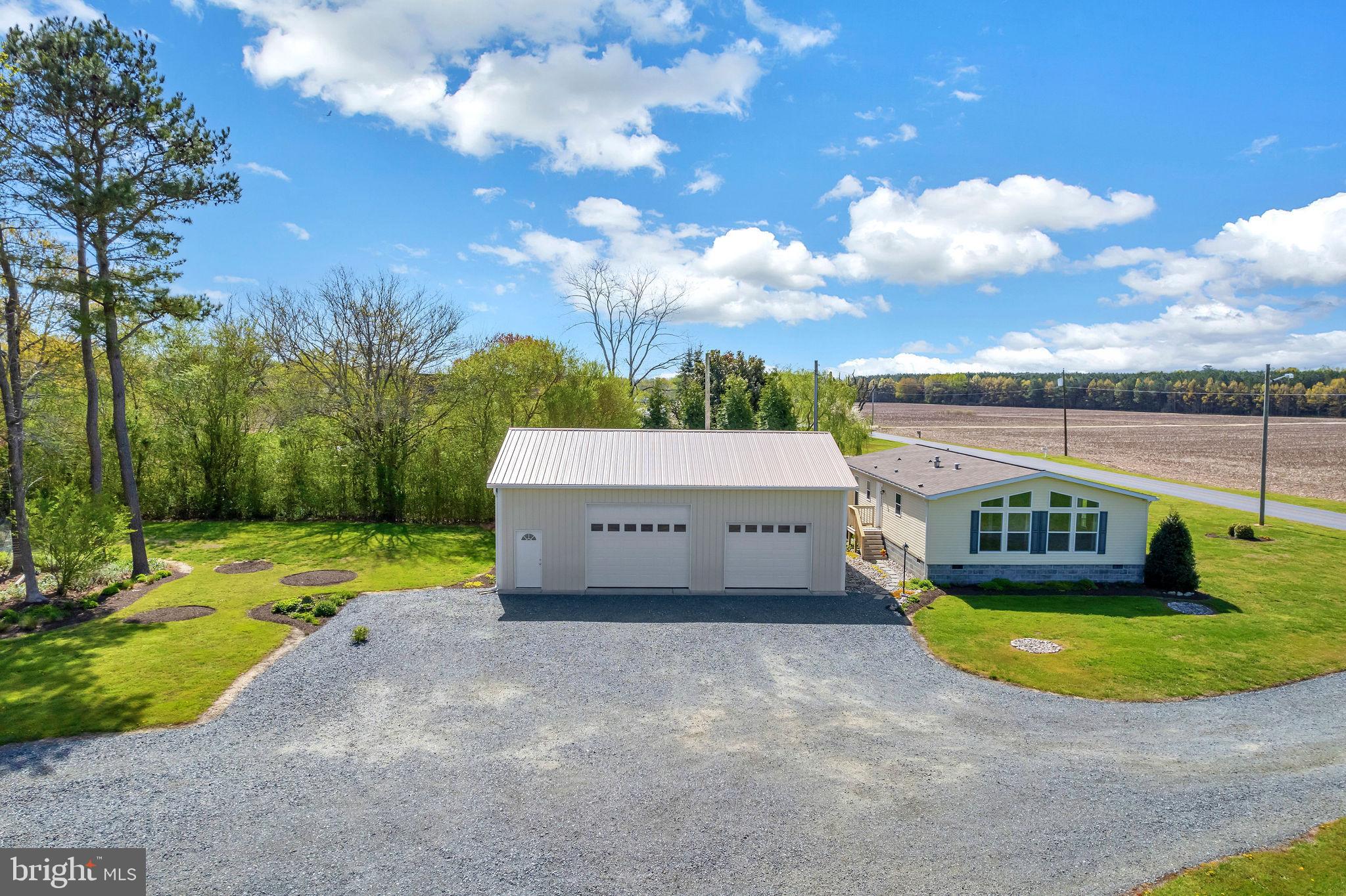 9811 Peerless Road Bishopville, MD 21813 - Photo 8 of 66 a view of a house with a swimming pool and a yard