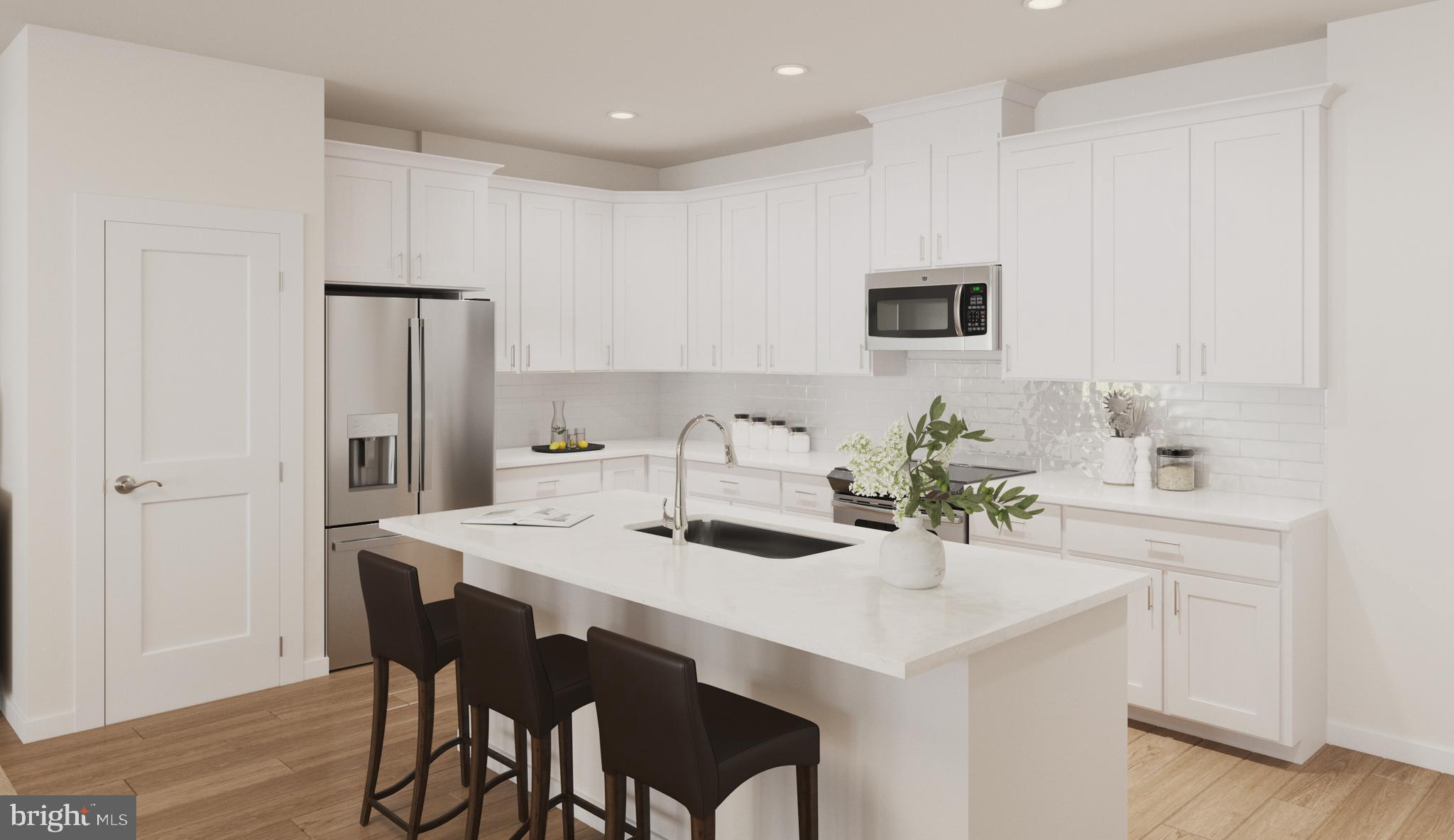 a kitchen with a dining table and chairs