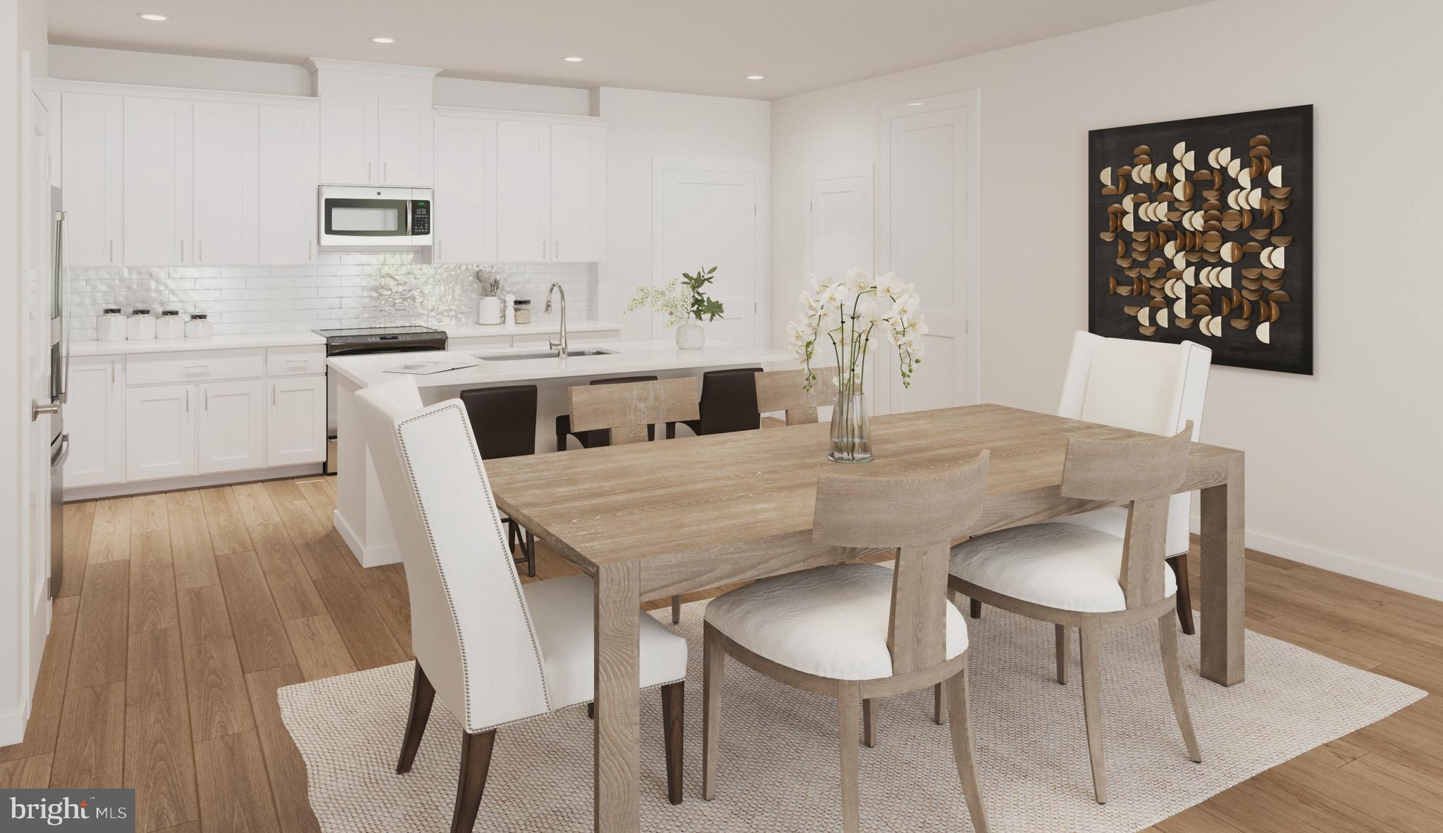1669 Bandit Loop, Unit 305A Reston, VA 20190 - Photo 3 of 30 a view of a dining room with furniture and wooden floor