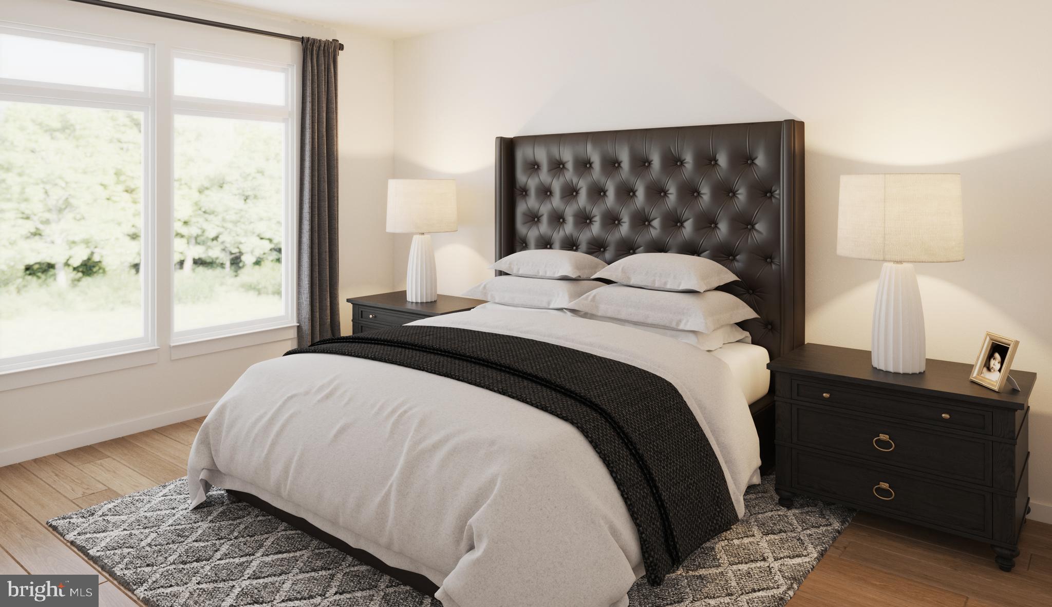 1669 Bandit Loop, Unit 305A Reston, VA 20190 - Photo 6 of 30 a bedroom with a bed and a window