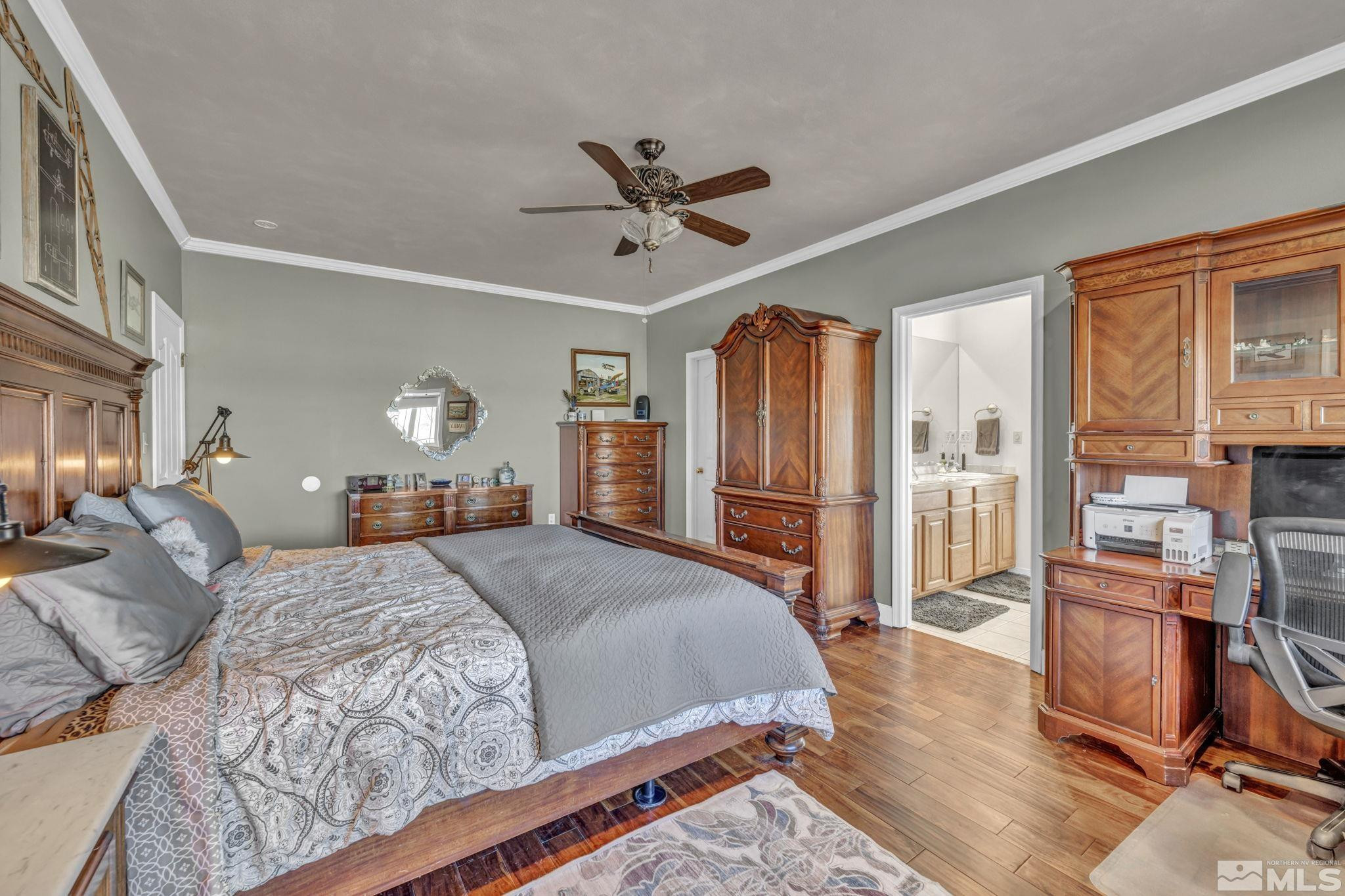 5650 South Allen Road Fallon, NV 89406 - Photo 31 of 40 a bedroom with a bed wooden floor and ceiling fan