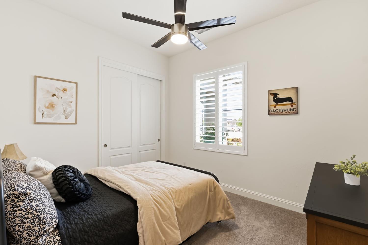 2100 Azalea Street Kingsburg, CA 93631 - Photo 22 of 54 a bedroom with a bed and a window