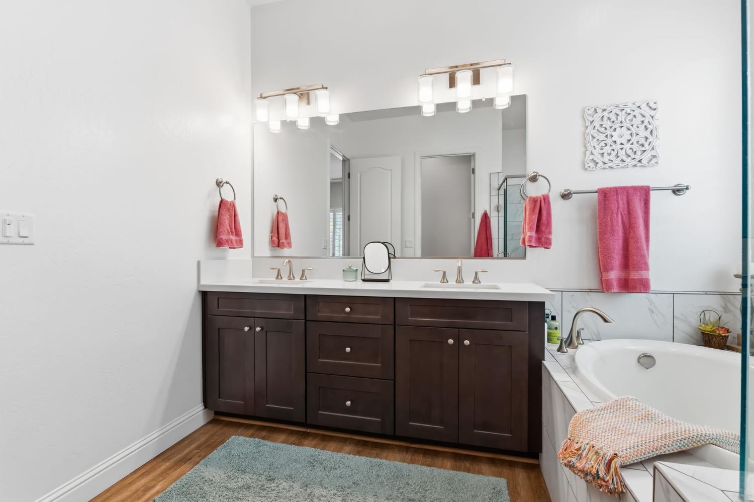 2100 Azalea Street Kingsburg, CA 93631 - Photo 30 of 54 a bathroom with a sink vanity tub shower and a mirror
