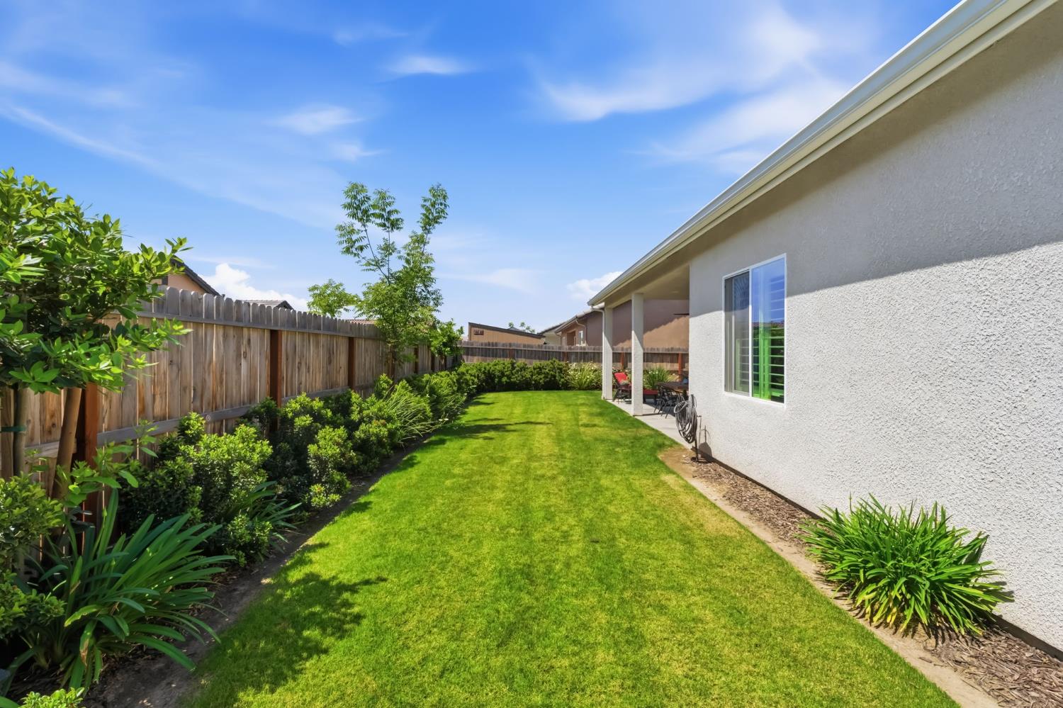 2100 Azalea Street Kingsburg, CA 93631 - Photo 33 of 54 a view of a house with a yard