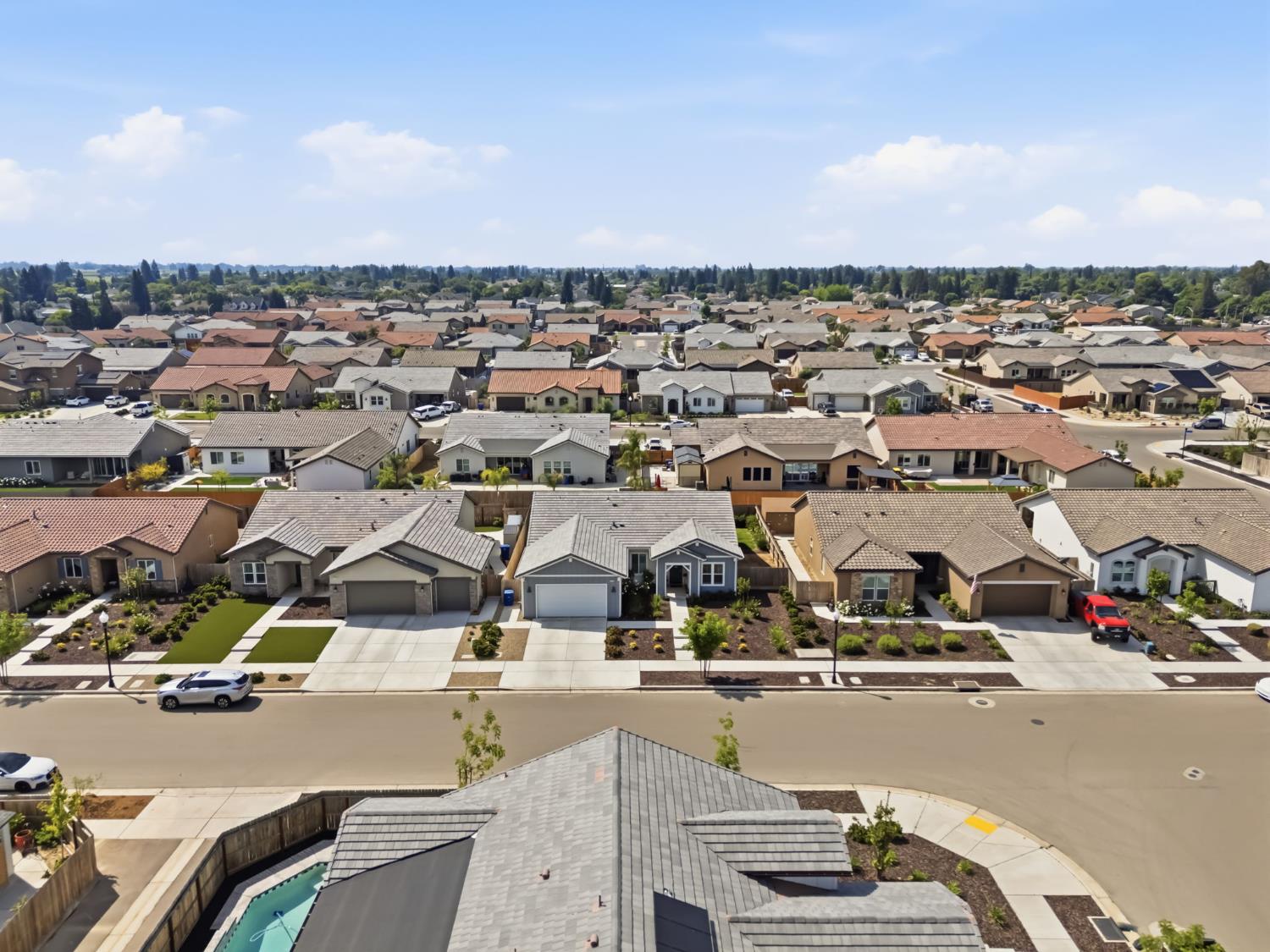 2100 Azalea Street Kingsburg, CA 93631 - Photo 41 of 54 an aerial view of residential houses with outdoor space