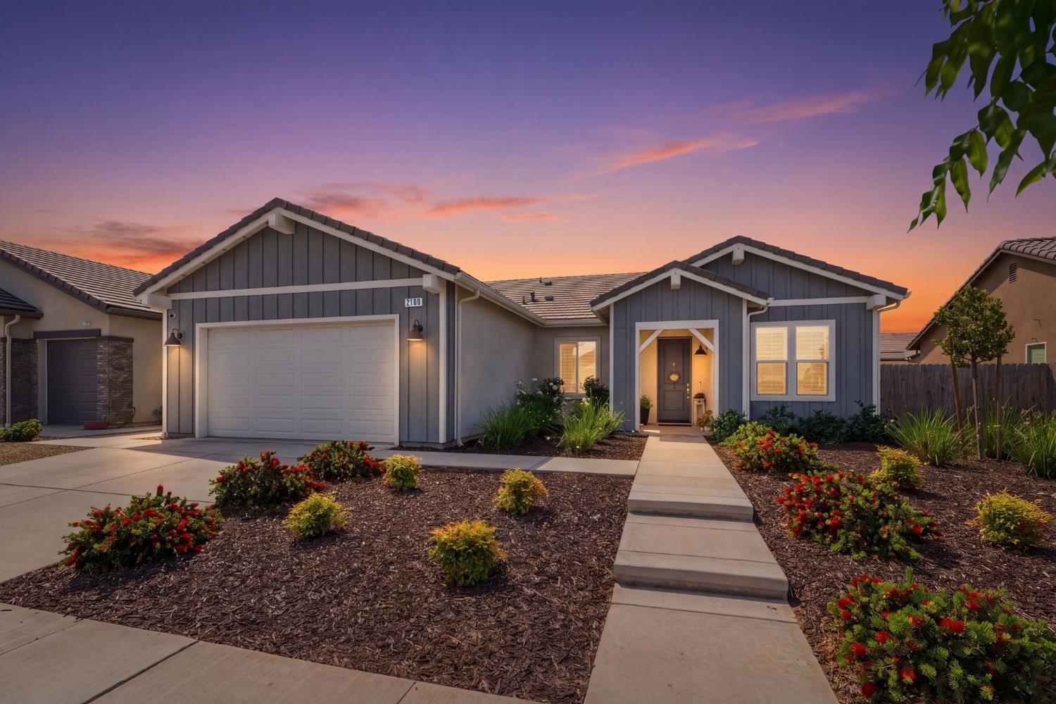 2100 Azalea Street Kingsburg, CA 93631 - Photo 6 of 54 a front view of a house with garden