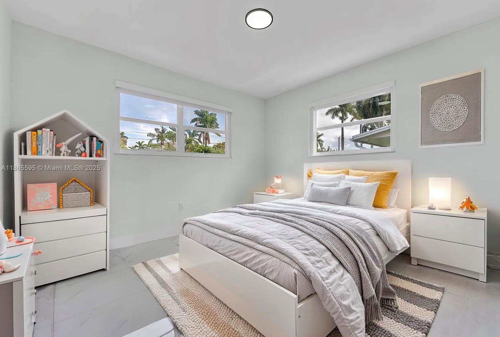 1446 Scott Street Hollywood, FL 33020 - Photo 23 of 47 a bedroom with a bed and a painting on the wall