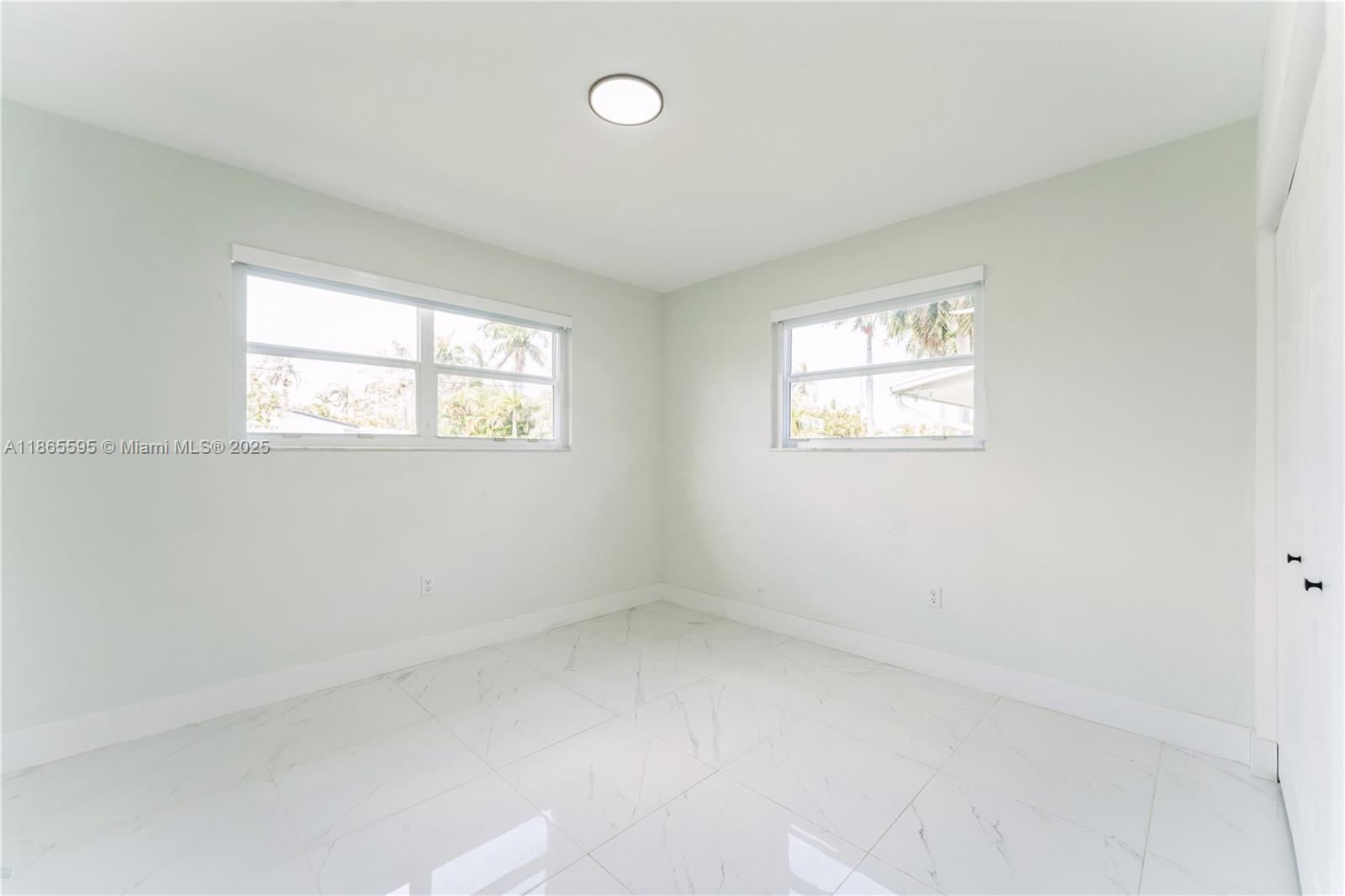 1446 Scott Street Hollywood, FL 33020 - Photo 24 of 47 an empty room with windows