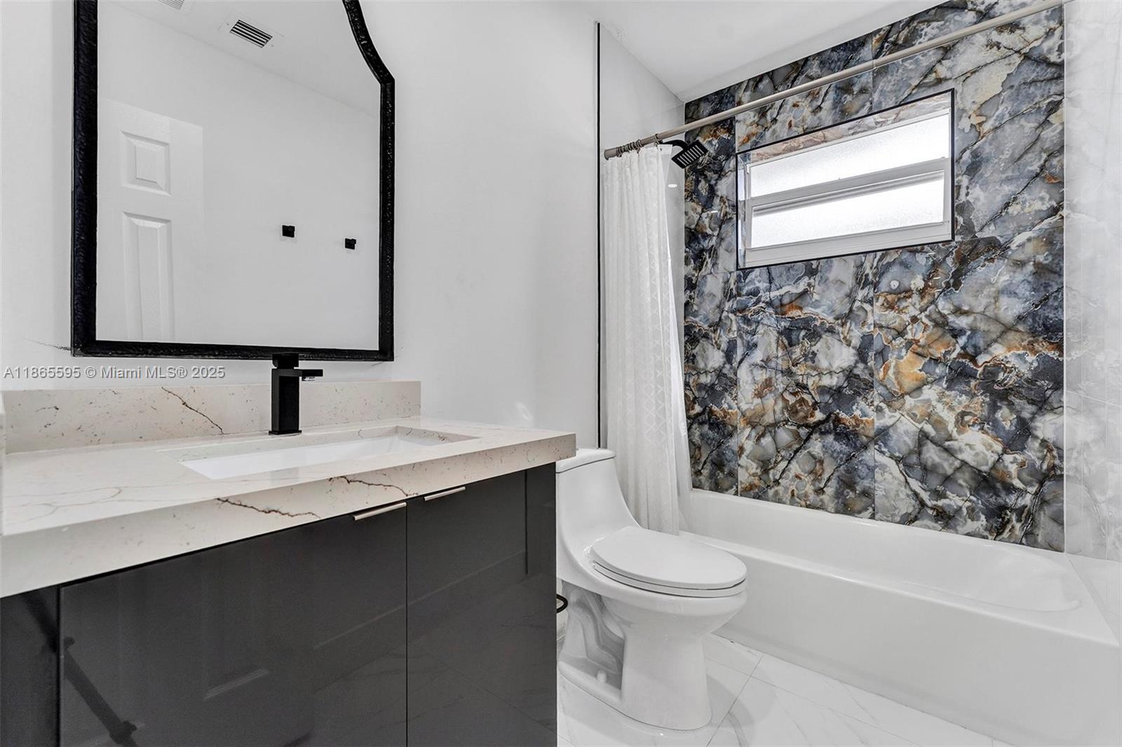 1446 Scott Street Hollywood, FL 33020 - Photo 26 of 47 a bathroom with a sink a toilet and shower