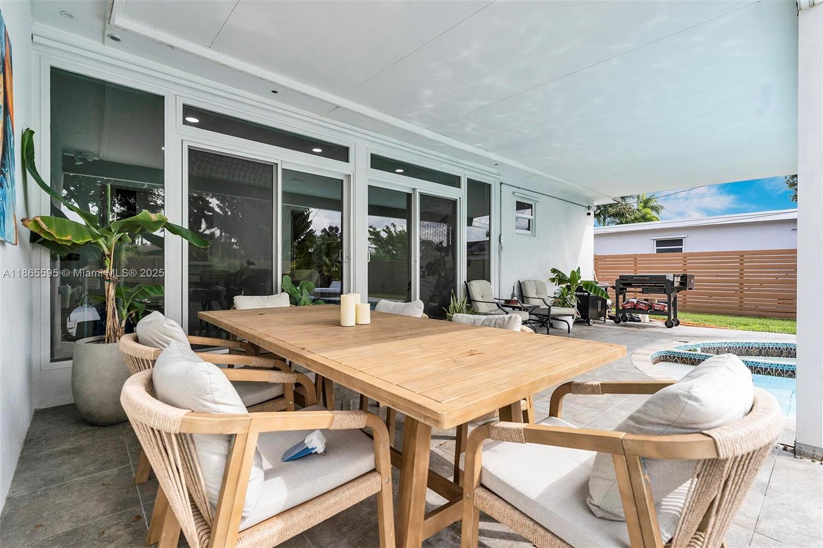 1446 Scott Street Hollywood, FL 33020 - Photo 34 of 47 a view of a patio with couches table and chairs