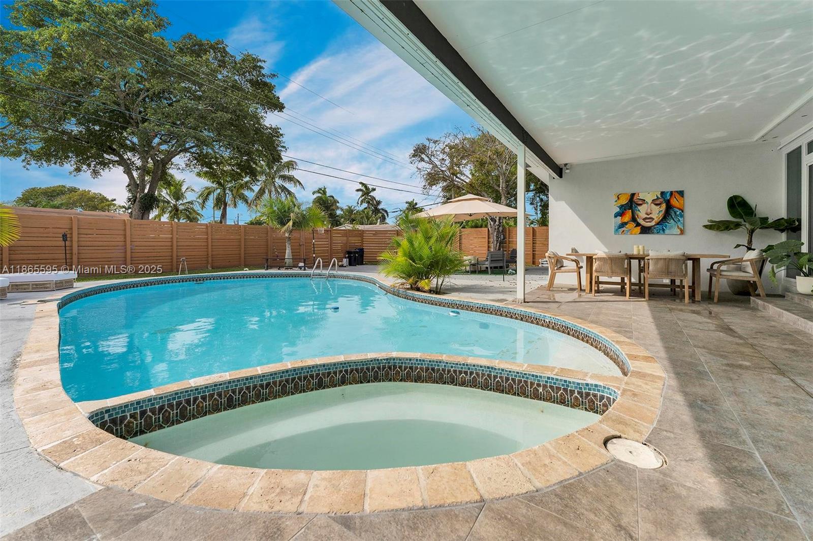 1446 Scott Street Hollywood, FL 33020 - Photo 35 of 47 a view of a swimming pool with a sitting space