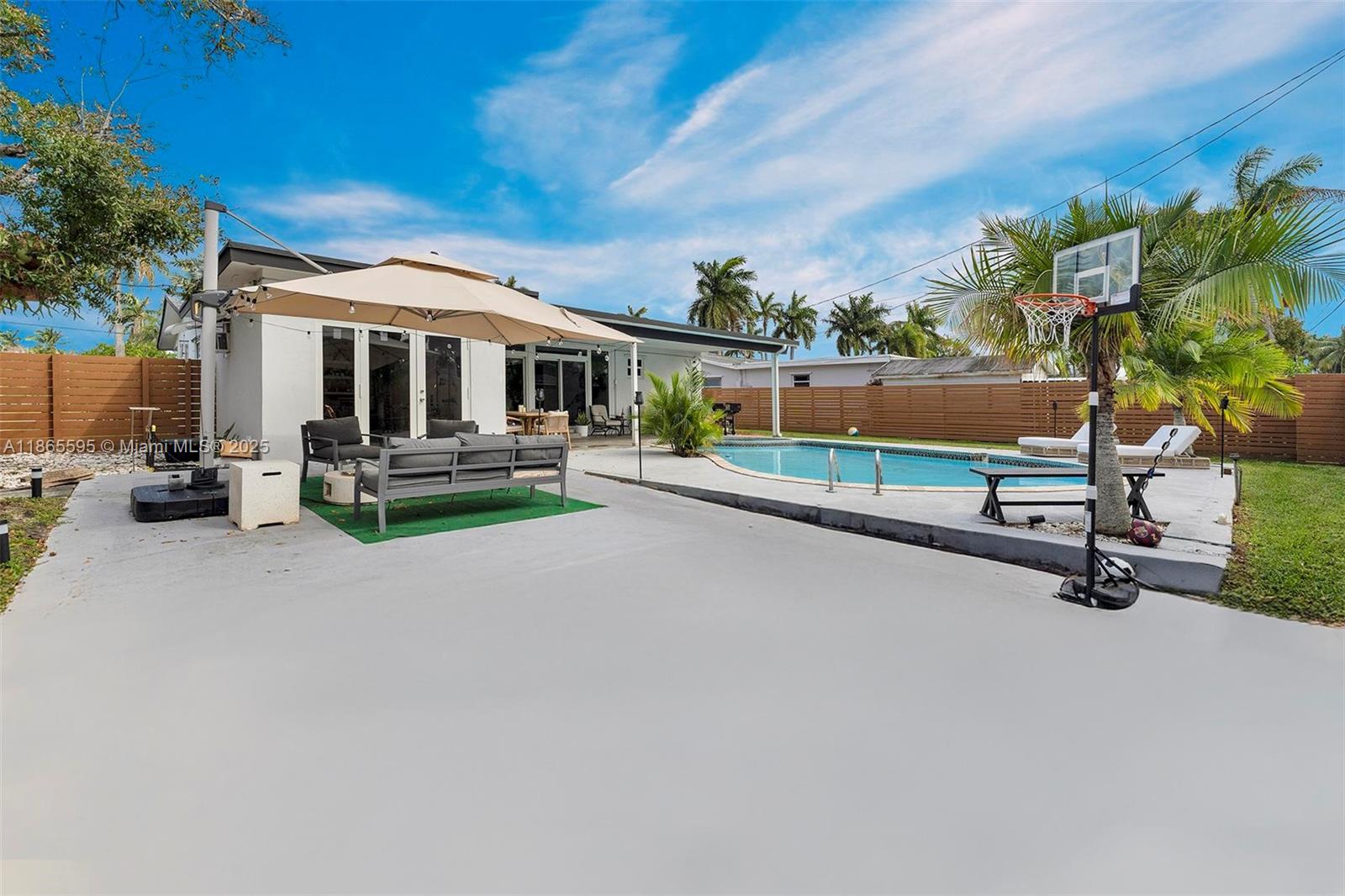 1446 Scott Street Hollywood, FL 33020 - Photo 37 of 47 a view of a house with swimming pool and sitting area