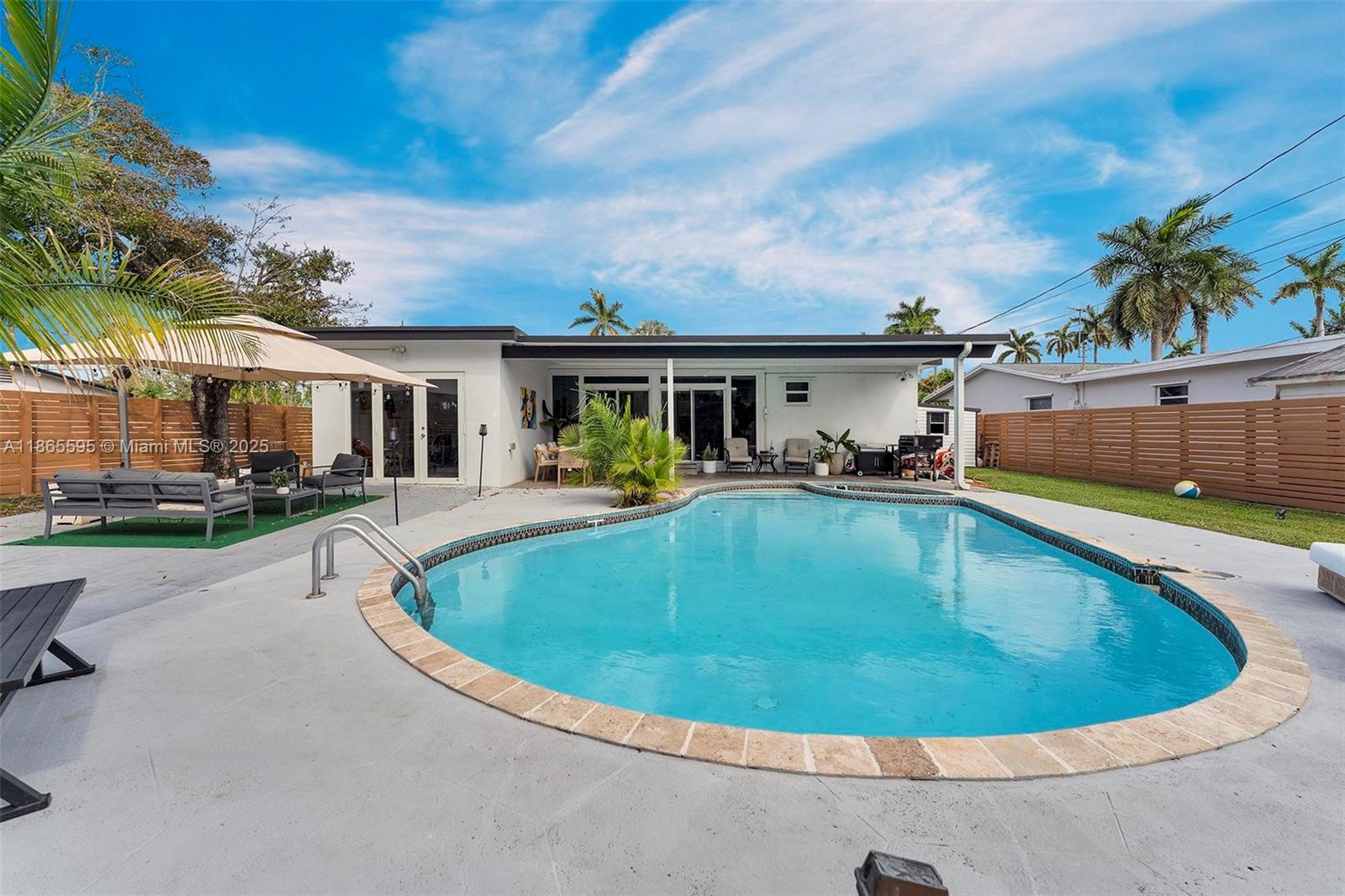 1446 Scott Street Hollywood, FL 33020 - Photo 39 of 47 a view of outdoor space yard swimming pool and deck