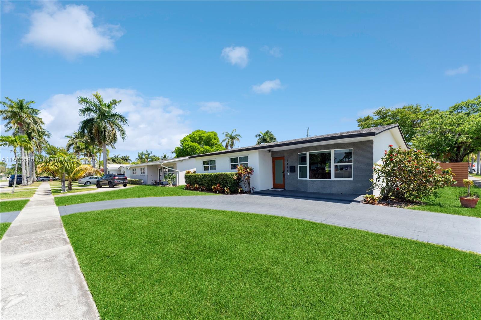 1446 Scott Street Hollywood, FL 33020 - Photo 43 of 47 a front view of a house with a garden and yard
