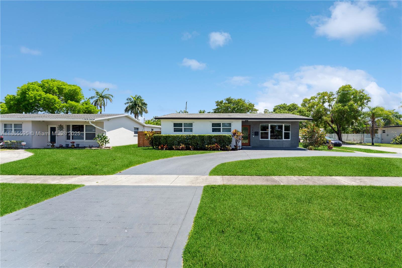 1446 Scott Street Hollywood, FL 33020 - Photo 44 of 47 a front view of house with yard and green space