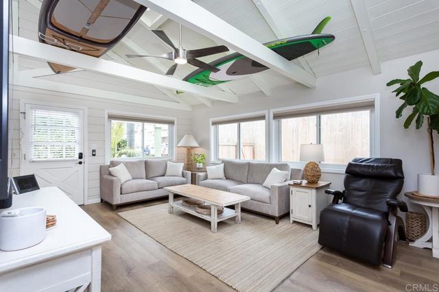a kitchen with white cabinets and a stove
