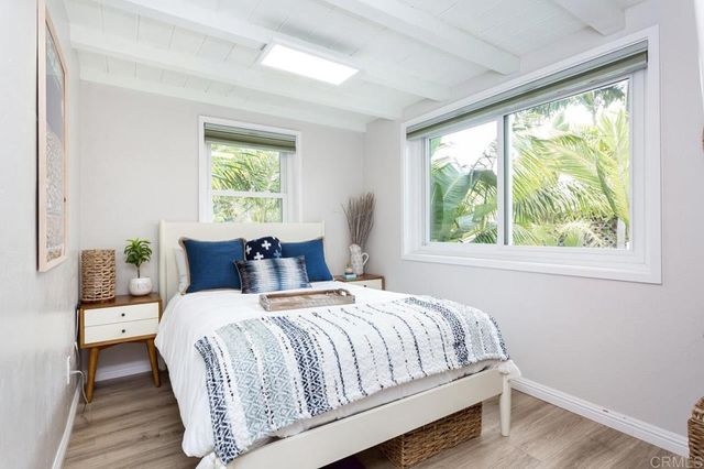 a bedroom with bed and window