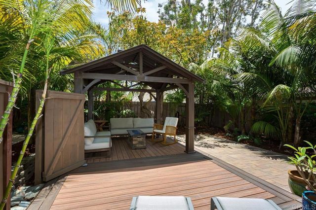 an aerial view of multiple houses with yard