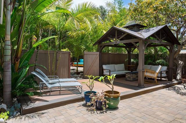 an aerial view of a house with a yard and a fountain