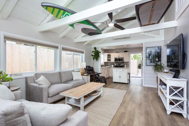a view of living room with furniture and flat screen tv