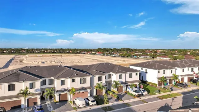 an aerial view of a house with a ocean view