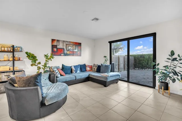 a kitchen with stainless steel appliances granite countertop wooden cabinets a stove top oven a sink and dishwasher