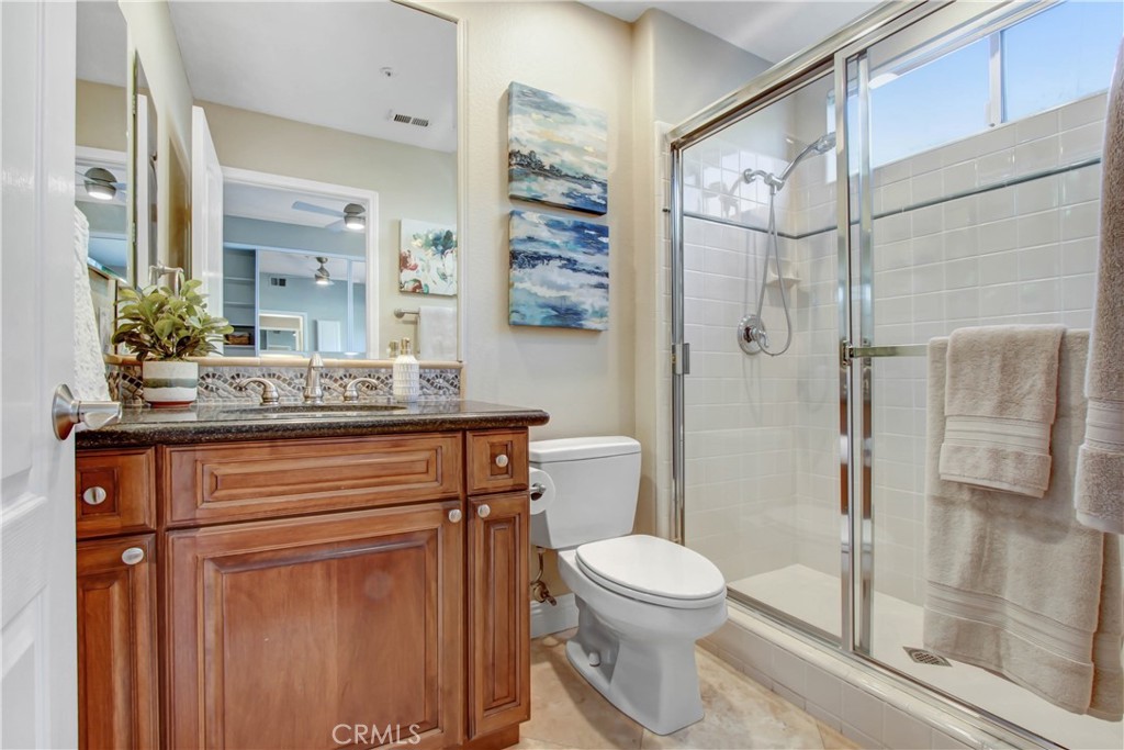 12036 Wood Ranch Road Granada Hills, CA 91344 - Photo 19 of 55 Downstairs Bedroom Ensuite Private Bathroom