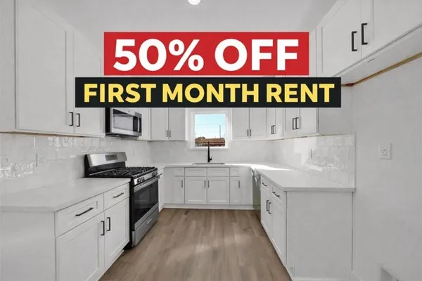 a kitchen with stainless steel appliances granite countertop a sink and dishwasher a refrigerator