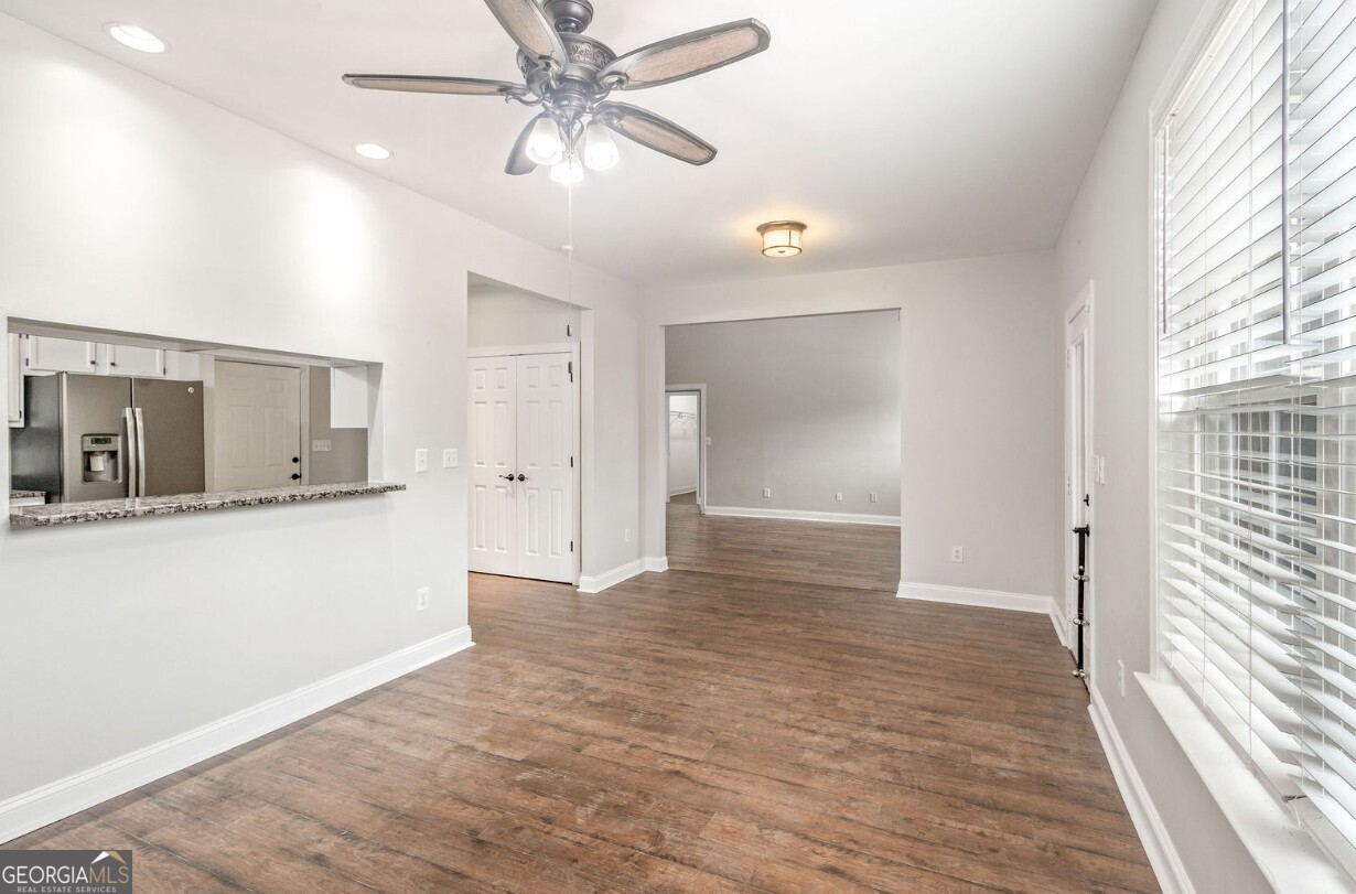 82 Newton Road LaGrange, GA 30240 - Photo 17 of 45 a view of an empty room with wooden floor and a window