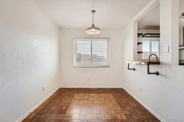 wooden floor in an empty room and a window
