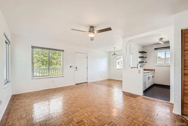 a view of a big room with windows and cabinet