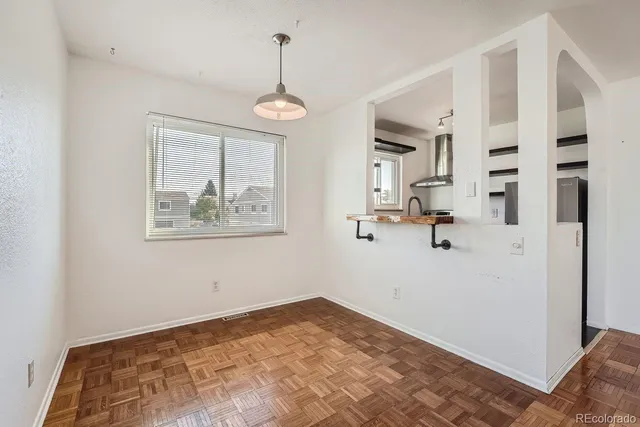 a view of empty room with a ceiling fan