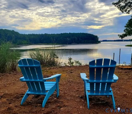 a view of a chairs and table in the patio