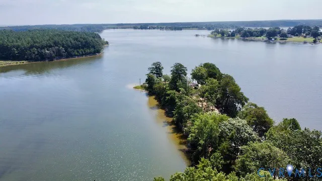 an aerial view of a houses with a lake view