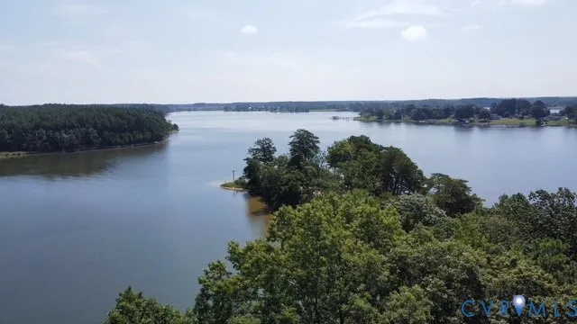 a view of a lake with houses in the back