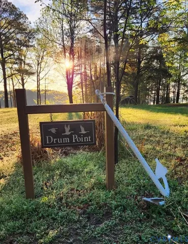 a view of swimming pool with an outdoor seating and a bench