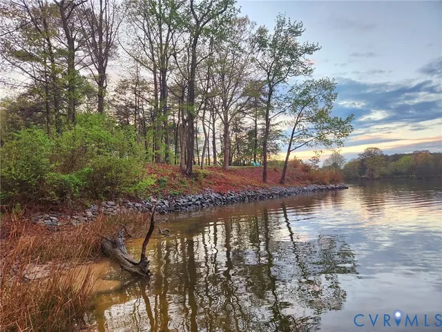 a view of a lake with lots of trees