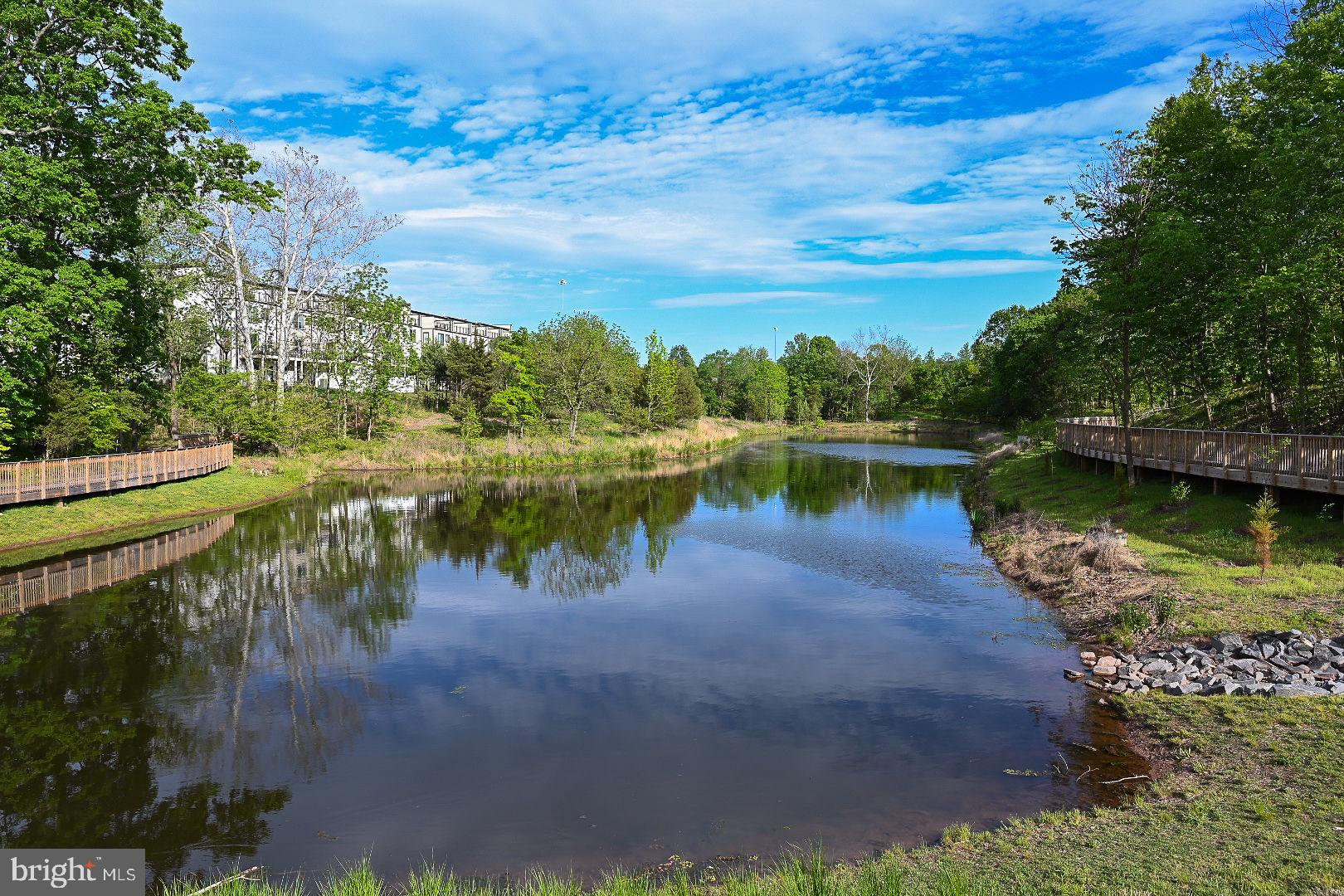 4967 Lakeside Crossing Chantilly, VA 20151 - Photo 13 of 45 a view of a lake with houses in the back