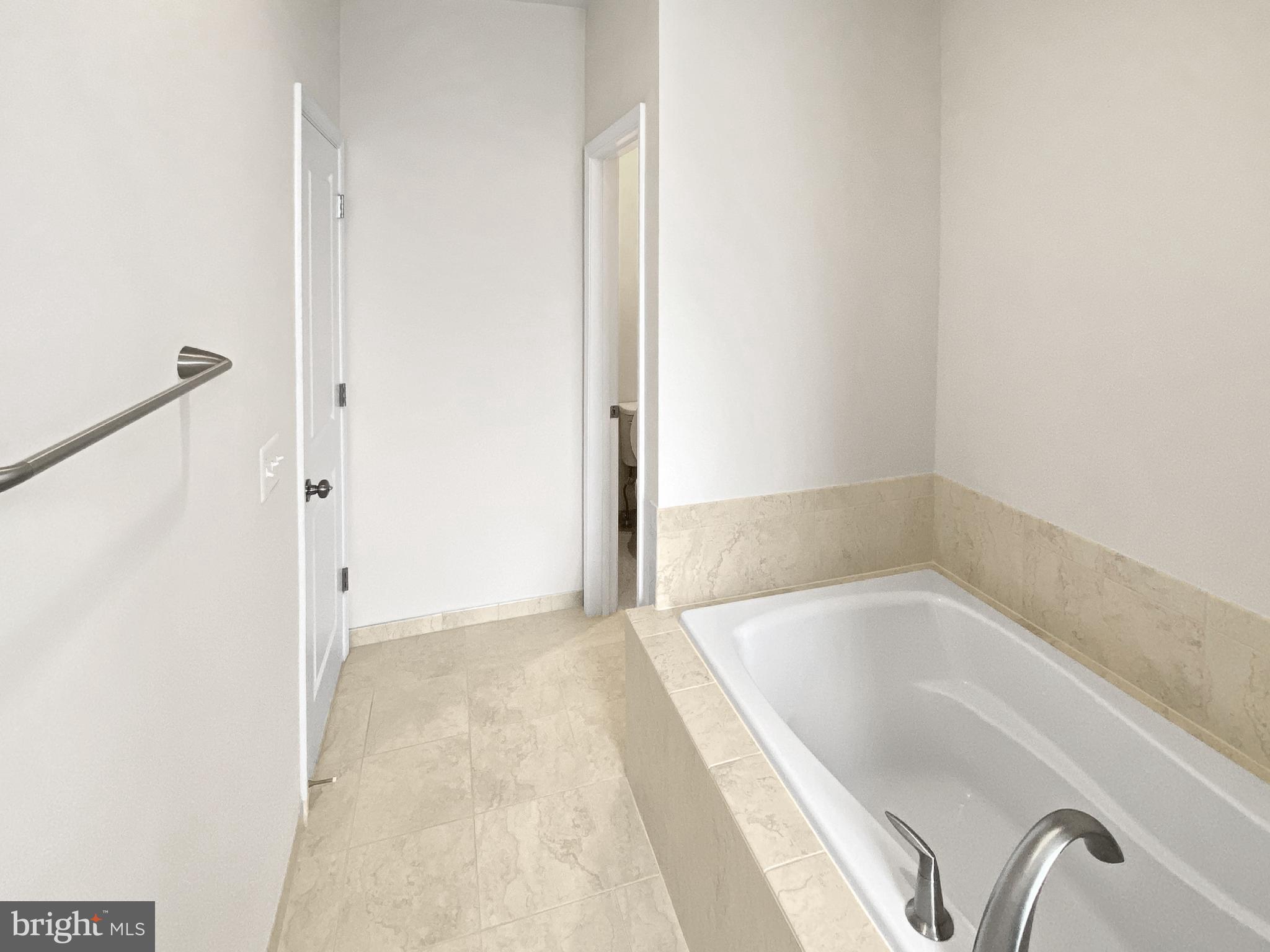 4967 Lakeside Crossing Chantilly, VA 20151 - Photo 26 of 45 a bathroom with a tub shower and sink