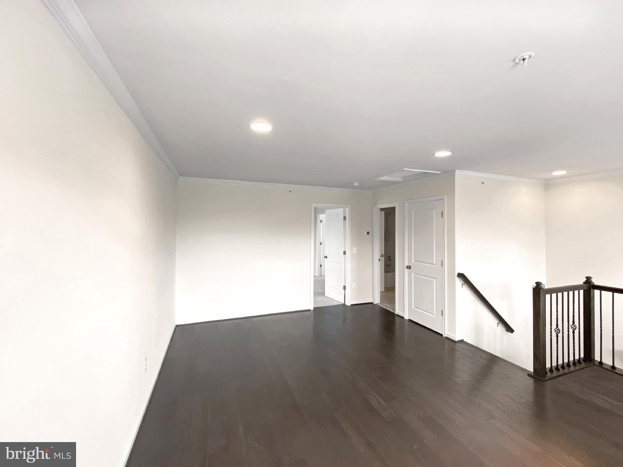 4967 Lakeside Crossing Chantilly, VA 20151 - Photo 30 of 45 a view of an empty room with wooden floor
