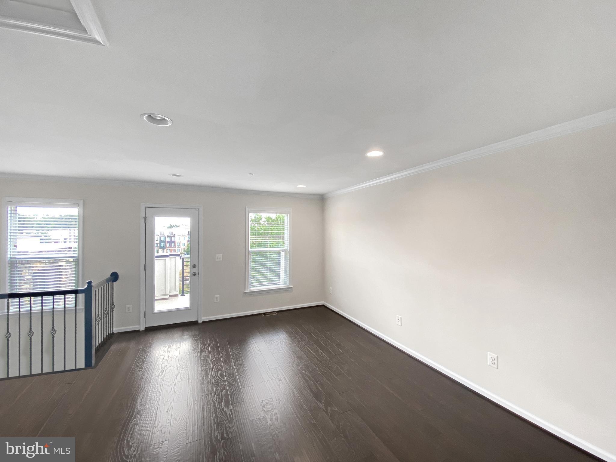 4967 Lakeside Crossing Chantilly, VA 20151 - Photo 31 of 45 an empty room with wooden floor and windows